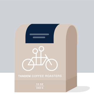 West End Blues coffee packaging with navy backdrop beige curves and Tandem Coffee Roasters branding