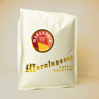 Wakerobin Filter coffee bag with a red round label and sunburst motif on white packaging