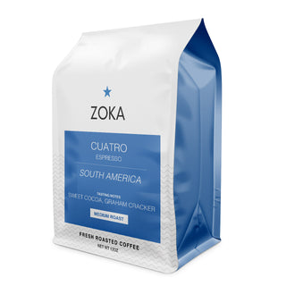 Zoka Cuatro espresso bag white with blue label and subtle wave pattern