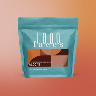 Aldo's coffee bag in turquoise against an orange gradient backdrop.