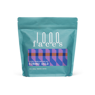 Biranu Dulo Ethiopian coffee bag by 1000 Faces with teal bag and decorative label