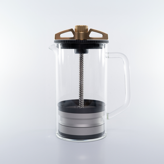 Side view of The BIRD coffee brewer with bronze crown glass carafe and handle