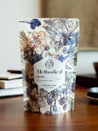 Blue Boy whole bean coffee bag from Methodical Coffee with a blue floral pattern and label.