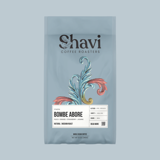 Bombe Abore coffee bag featuring the Shavi Coffee Roasters logo on a pale blue package