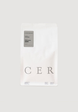 Synthesis coffee bag from Ceremony Coffee Roasters with minimalist white packaging and a gray label
