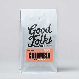 Colombia light roast whole bean coffee bag from Good Folks Coffee with pink Colombia label.