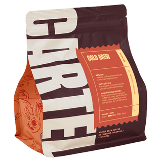 Cold Brew Blend coffee bag with an orange label on a dark maroon bag and brewing instructions visible