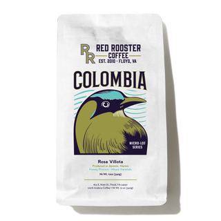 Colombia Aponte Honey Rosa Villota coffee bag with a bold COLOMBIA label and a colorful bird illustration
