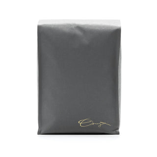Black Eclipse coffee bag showing a large silver ONYX logo and a gold signature at the bottom.