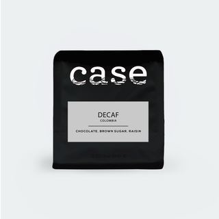 Case Coffee Roasters Decaf Colombia bag with gray label listing chocolate brown sugar and raisin