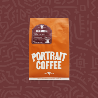 Orange Colombia Portrait Coffee Sugarcane Decaf bag with tasting notes caramel and red apple.