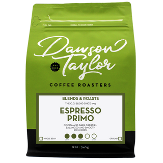 Green Dawson Taylor Espresso Primo coffee bag with a white label showing Espresso Primo in bold typography