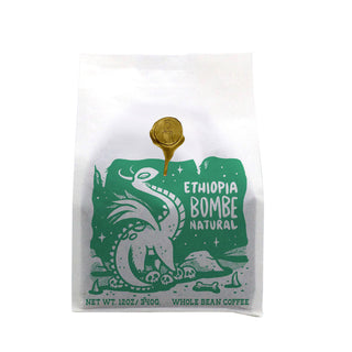 Brandywine Coffee Roasters Ethiopia Bombe Natural white bag with green graphic and a gold wax seal.