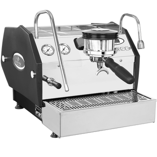 Close up of La Marzocco GS3 front panel with dual gauges, chrome group head, and portafilter.