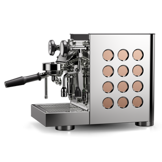 Close up of the Rocket Appartamento TCA espresso machine front showing chrome fittings and peach colored control discs.