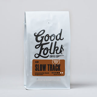 White stand up bag of Good Folks Coffee Slow Track espresso blend with an orange brown label