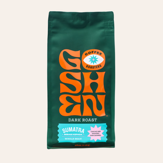 Green Sumatra Bebagi Kepada coffee bag with a bold orange logo