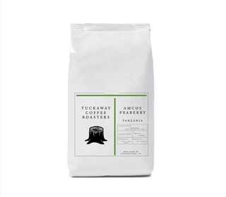 Tuckaway AMCOS Peaberry Tanzania coffee bag featuring a clean white package and green accented label.
