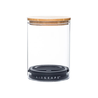 Clear glass Airscape canister with a wooden lid and dark base