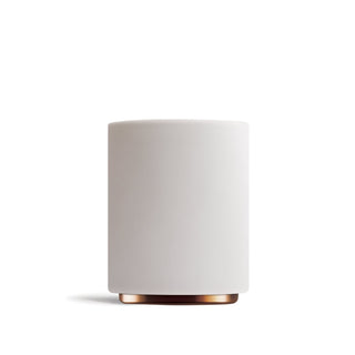 Close up of a white Fellow Monty Cup with a copper base accent.